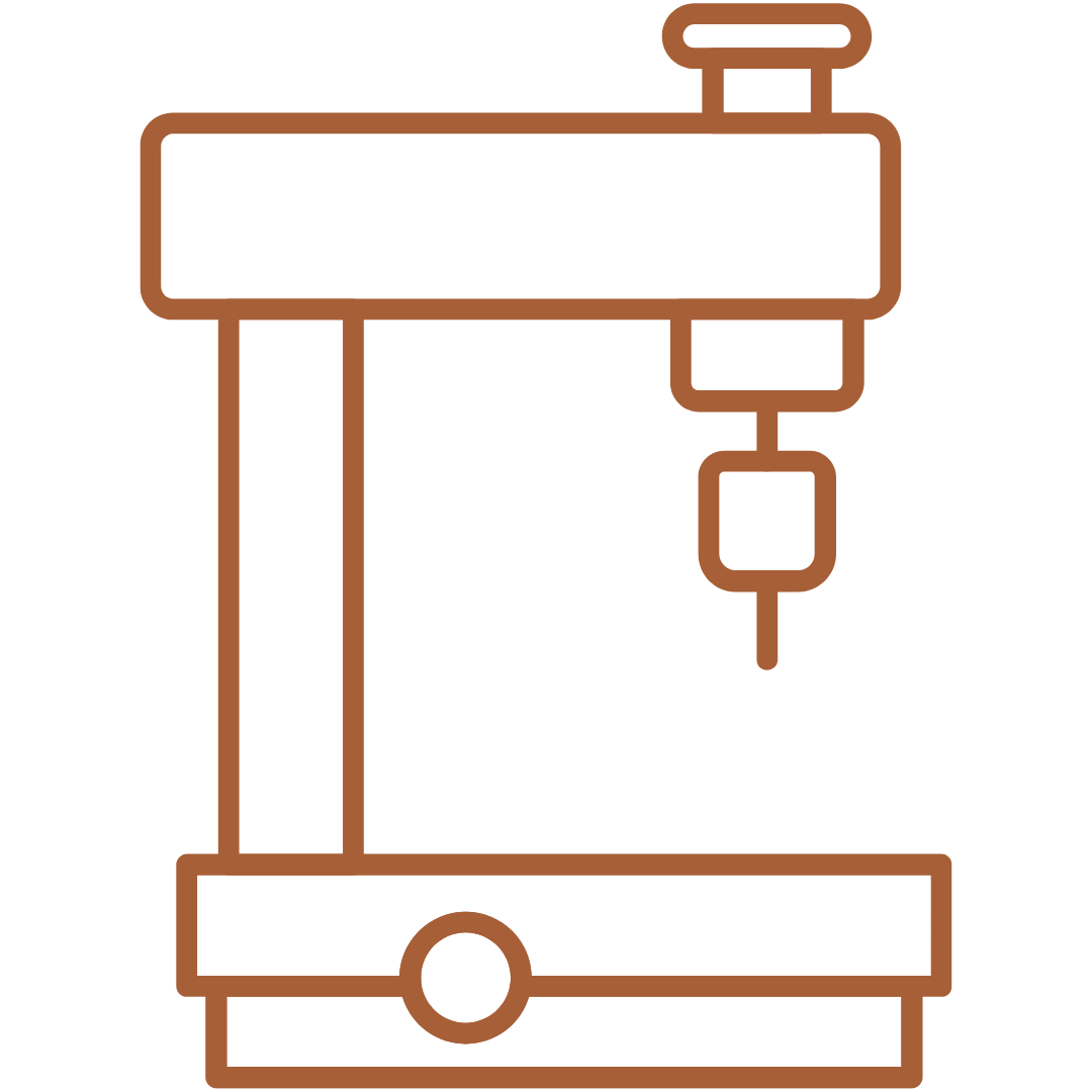 Brown icon of a engraving machine on a white background